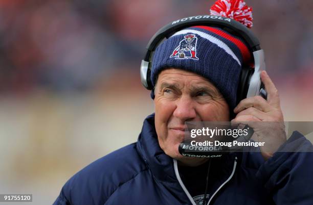 Head coach Bill Belichick of the New England Patriots leads his team against the Denver Broncos during NFL action at Invesco Field at Mile High on...