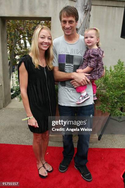 Pro Skateboarder Tony Hawk , his wife Lhotse Merriam and their daughter Kadence Clover Hawk arrive to the 'Tony Hawk: Ride Presents Stand Up For...