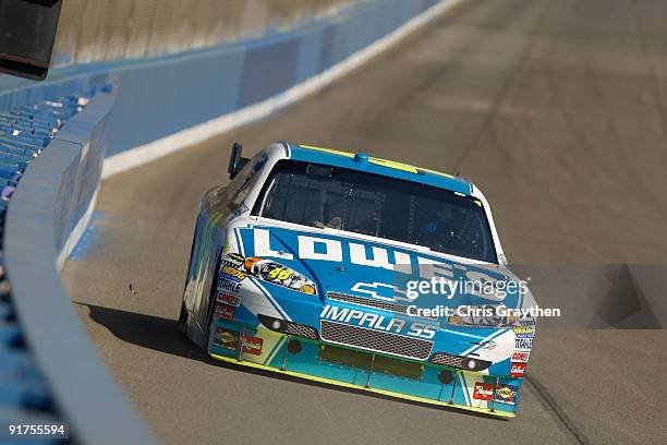 Jimmie Johnson, driver of the Lowe's Chevrolet, races during the NASCAR Sprint Cup Series Pepsi 500 at Auto Club Speedway on October 11, 2009 in...
