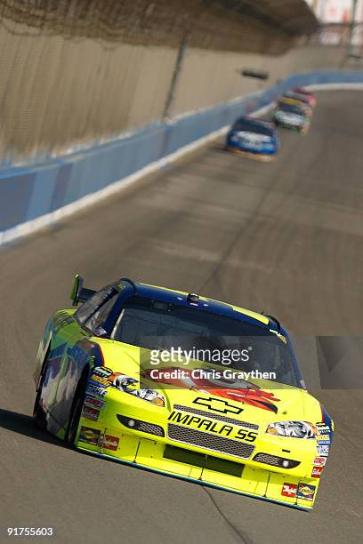 Mark Martin, driver of the Kellogg's Chevrolet, races during the NASCAR Sprint Cup Series Pepsi 500 at Auto Club Speedway on October 11, 2009 in...
