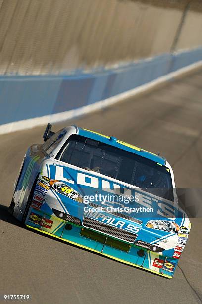 Jimmie Johnson, driver of the Lowe's Chevrolet, races during the NASCAR Sprint Cup Series Pepsi 500 at Auto Club Speedway on October 11, 2009 in...