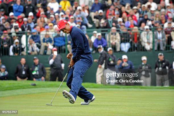 Tiger Woods of the U.S. Team reacts after sinking a birdie putt on during the final round singles matches for The Presidents Cup at Harding Park Golf...