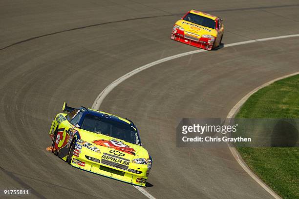 Mark Martin, driver of the Kellogg's Chevrolet, races during the NASCAR Sprint Cup Series Pepsi 500 at Auto Club Speedway on October 11, 2009 in...