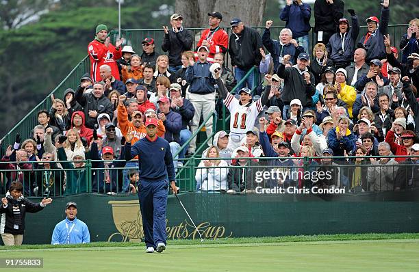 Tiger Woods of the U.S. Team reacts after sinking a birdie putt on during the final round singles matches for The Presidents Cup at Harding Park Golf...