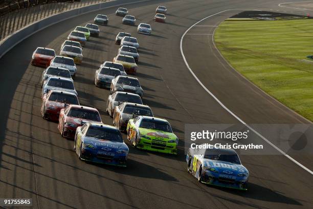 Jimmie Johnson, driver of the Lowe's Chevrolet, leads teammate Jeff Gordon, driver of the Pepsi Chevrolet, on a restart during the NASCAR Sprint Cup...