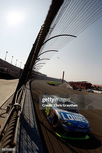 Jimmie Johnson, driver of the Lowe's Chevrolet, races during the NASCAR Sprint Cup Series Pepsi 500 at Auto Club Speedway on October 11, 2009 in...