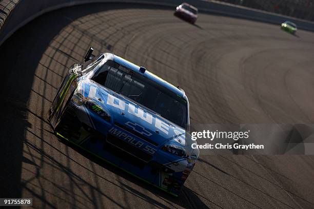 Jimmie Johnson, driver of the Lowe's Chevrolet, races during the NASCAR Sprint Cup Series Pepsi 500 at Auto Club Speedway on October 11, 2009 in...