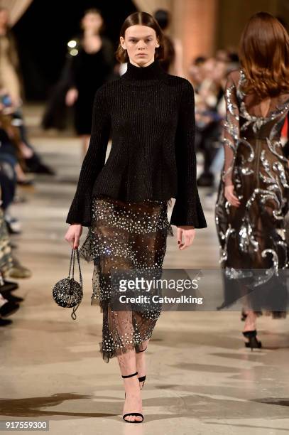Model walks the runway at the Oscar de la Renta Autumn Winter 2018 fashion show during New York Fashion Week on February 12, 2018 in New York, United...