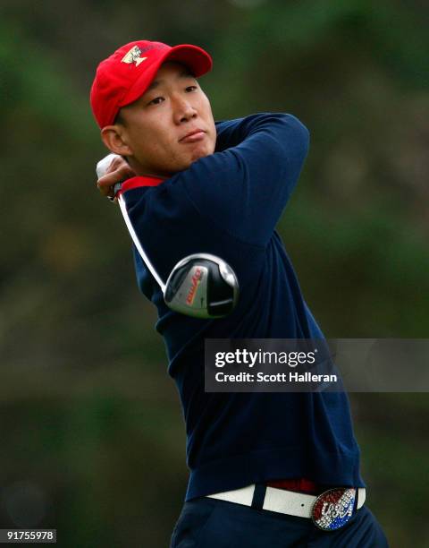 Anthony Kim of the USA Team watches his tee shot on the 12th hole during the Final Round Singles Matches of The Presidents Cup at Harding Park Golf...