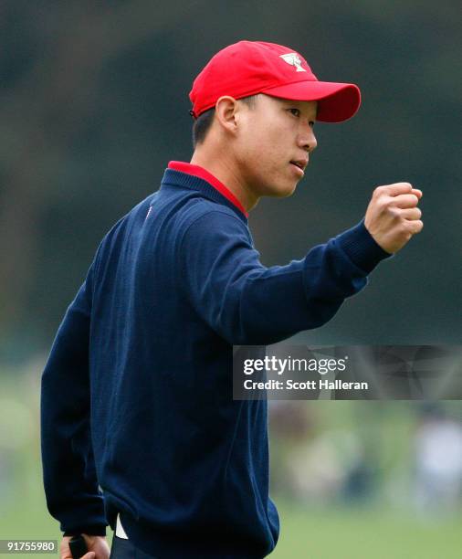 Anthony Kim of the USA Team celebrates a birdie putt on the seventh green during the Final Round Singles Matches of The Presidents Cup at Harding...