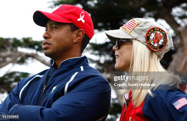 Tiger Woods of the USA Team waits with his wife Elin on the 13th green during the Final Round Singles Matches of The Presidents Cup at Harding Park...