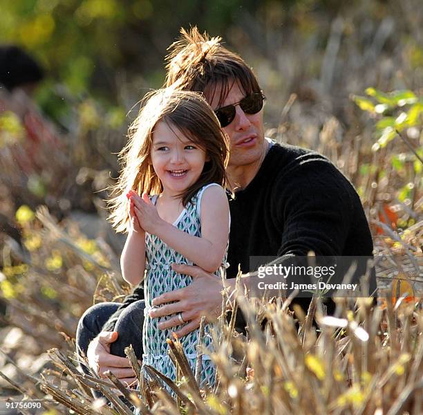 Suri Cruise and Tom Cruise visit Charles River Basin on October 10, 2009 in Cambridge, Massachusetts.