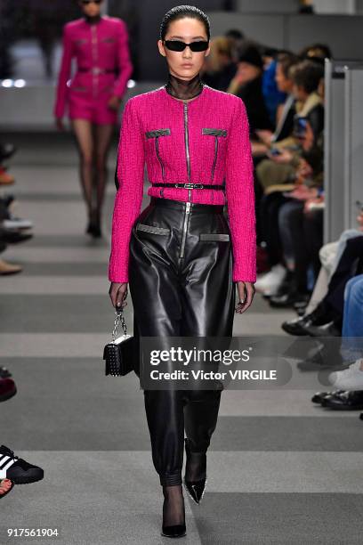 Model walks the runway at Alexander Wang Ready to Wear Fall/Winter 2018-2019 Fashion Show during New York Fashion Week on February 10, 2018 in New...