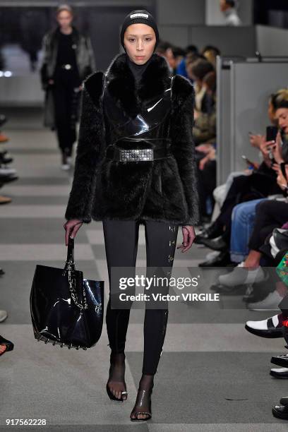 Model walks the runway at Alexander Wang Ready to Wear Fall/Winter 2018-2019 Fashion Show during New York Fashion Week on February 10, 2018 in New...