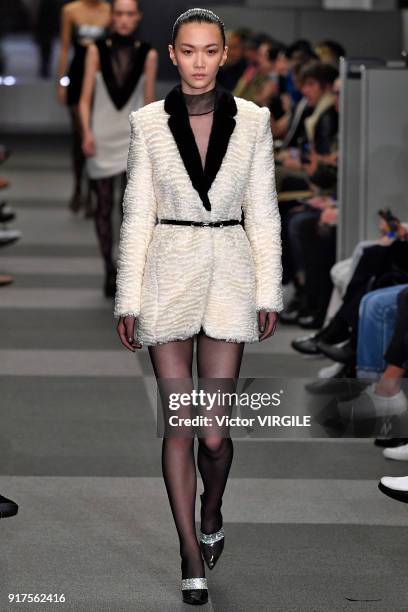 Model walks the runway at Alexander Wang Ready to Wear Fall/Winter 2018-2019 Fashion Show during New York Fashion Week on February 10, 2018 in New...