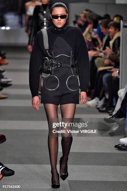 Model walks the runway at Alexander Wang Ready to Wear Fall/Winter 2018-2019 Fashion Show during New York Fashion Week on February 10, 2018 in New...