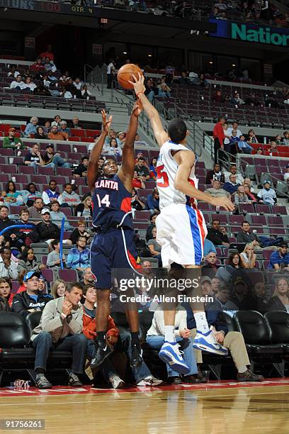 Frank Robinson of the Atlanta Hawks gets his shot blocked by Austin Day of the Detroit Pistons in a preseason game at the Palace of Auburn Hills on...