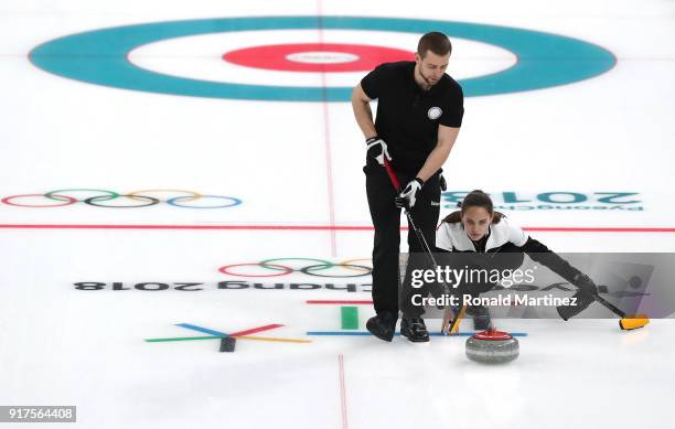 Anastasia Bryzgalova and Aleksandr Krushelnitckii of Olympic Athletes from Russia deliver a stone against Norway during the Curling Mixed Doubles...