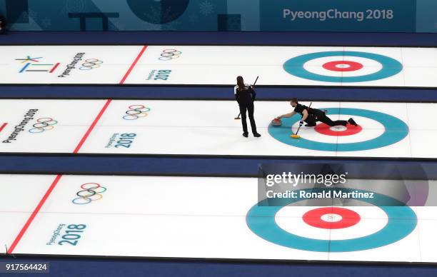 Anastasia Bryzgalova and Aleksandr Krushelnitckii of Olympic Athletes from Russia deliver a stone against Norway during the Curling Mixed Doubles...