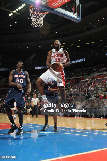 DaJuan Summers of the Detroit Pistons drives around Othello Hunter of the Atlanta Hawks in a preseason game at the Palace of Auburn Hills on October...