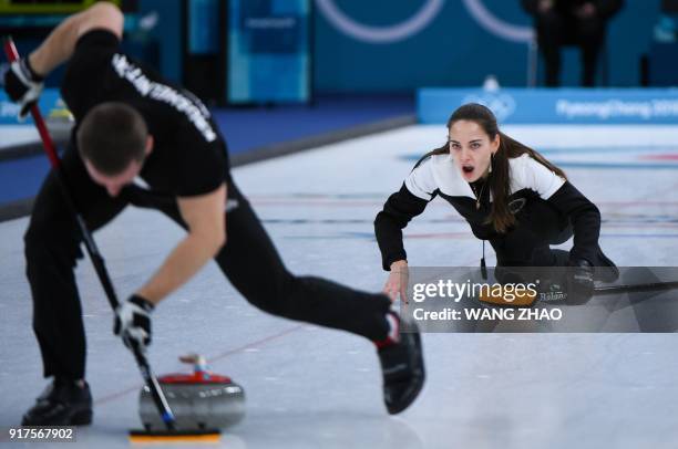 Russia's Anastasia Bryzgalova shouts for instructions during the curling mixed doubles bronze medal game during the Pyeongchang 2018 Winter Olympic...