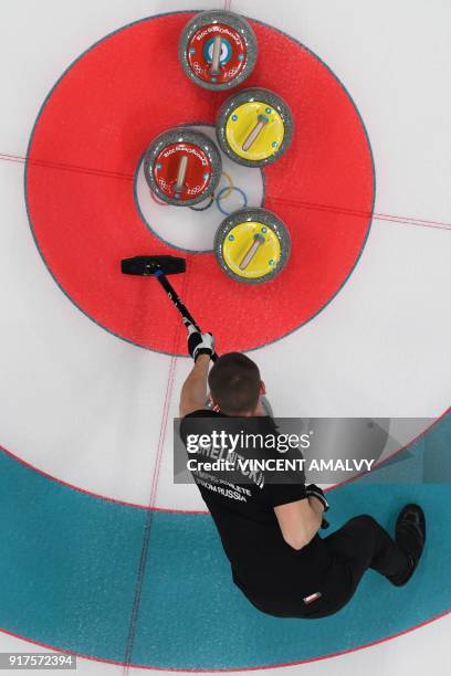 Russia's Aleksandr Krushelnitckii competes during the curling mixed doubles bronze medal game during the Pyeongchang 2018 Winter Olympic Games at the...