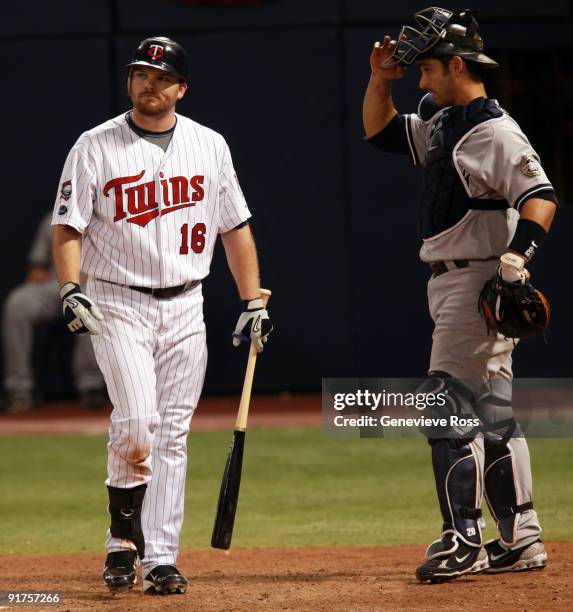 Jason Kubel of the Minnesota Twins walks away from home plate after being struck out in the ninth inning by New York Yankees closer Mariano Rivera in...