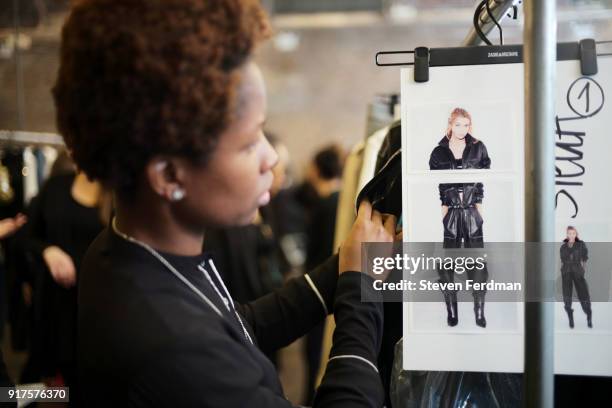 Stella Maxwell prepares backstage for the Zadig & Voltaire fashion show during New York Fashion Week at Cedar Lake Studios on February 12, 2018 in...