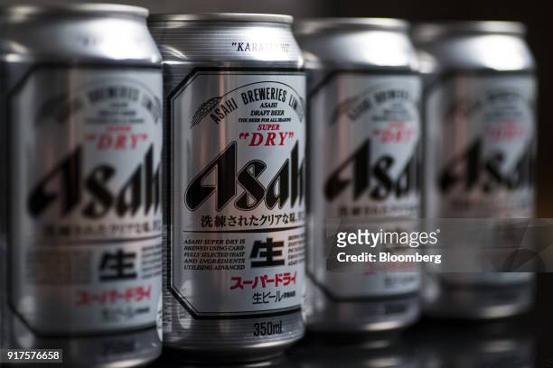 Cans of Asahi Breweries Ltd.'s Asahi Super Dry beer are arranged for a photograph in Tokyo, Japan, on Monday, Feb. 12, 2018. Asahi Group Holdings...