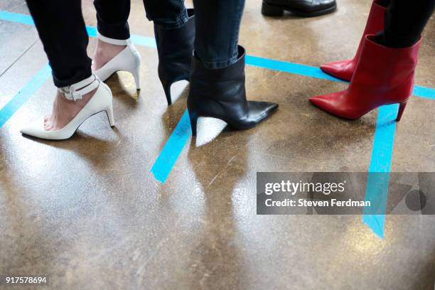 Models prepare backstage for the Zadig & Voltaire fashion show during New York Fashion Week at Cedar Lake Studios on February 12, 2018 in New York...