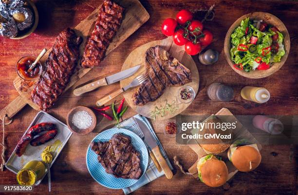 variation of roasted bbq rib eye,  t-bone steak, spareribs and burgers - rib stock pictures, royalty-free photos & images