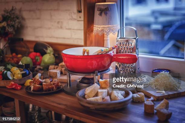 delicious swiss cheese fondue in a pot served with bread - cheese fondue stock pictures, royalty-free photos & images