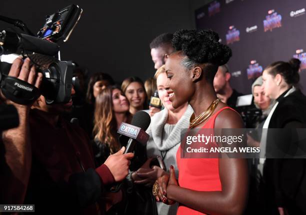 Actress Lupita Nyong'o arrives for the MARVEL Black Panther fashion week celebration "Welcome to Wakanda" at Industria on February 12 in New York. /...