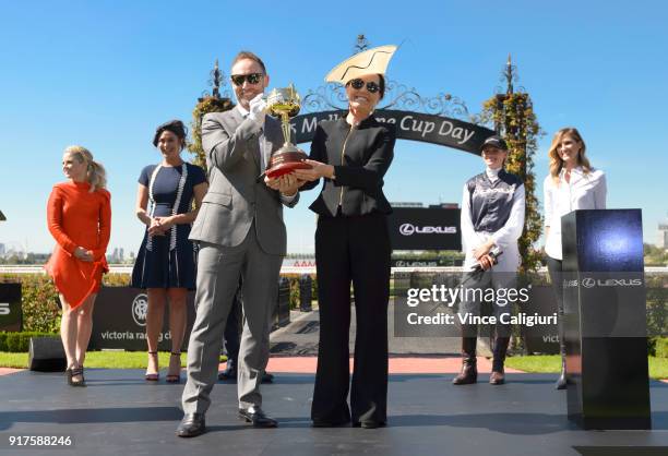 Scott Thompson and Amanda Elliott hold the 2018 Lexus Melbourne Cup during the VRC Melbourne Cup Sponsorship Announcement at Flemington Racecourse on...