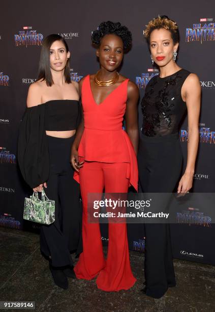 Michelle Ochs, Lupita Nyong'o, and Carly Cushnie attend the Marvel Studios Black Panther Welcome to Wakanda New York Fashion Week Showcase at...