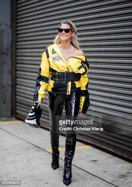 Helena Bordon wearing vinyl pants, yellow racing jacket seen outside Ralph Lauren on February 12, 2018 in New York City.