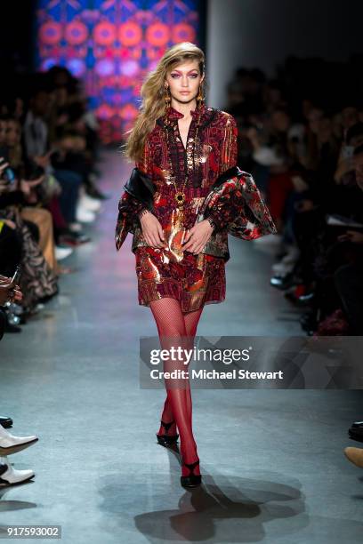 Gigi Hadid walks the runway during the Anna Sui fashion show during New York Fashion Week at Gallery I at Spring Studios on February 12, 2018 in New...