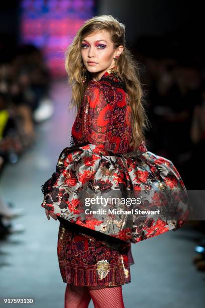 Gigi Hadid walks the runway during the Anna Sui fashion show during New York Fashion Week at Gallery I at Spring Studios on February 12, 2018 in New...