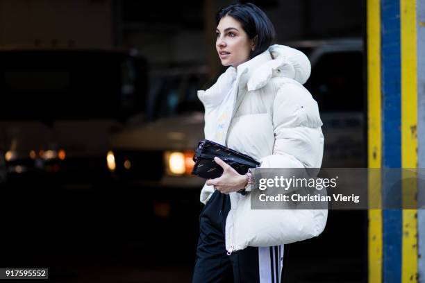 Anna Nooshin wearing white puffer jacket seen outside Zadig & Voltaire on February 12, 2018 in New York City.