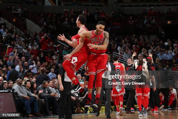 Omer Asik of the Chicago Bulls and Denzel Valentine of the Chicago Bulls celebrate against the Orlando Magic on February 12, 2018 at the United...