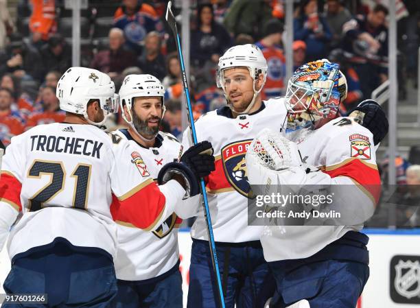 Vincent Trocheck, Derek MacKenzie, Alex Petrovic and James Reimer of the Florida Panthers celebrate after winning the game against the Edmonton...