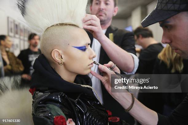 Model prepares backstage during the Kaimin fashion show at the Glass Houses on February 12, 2018 in New York City.