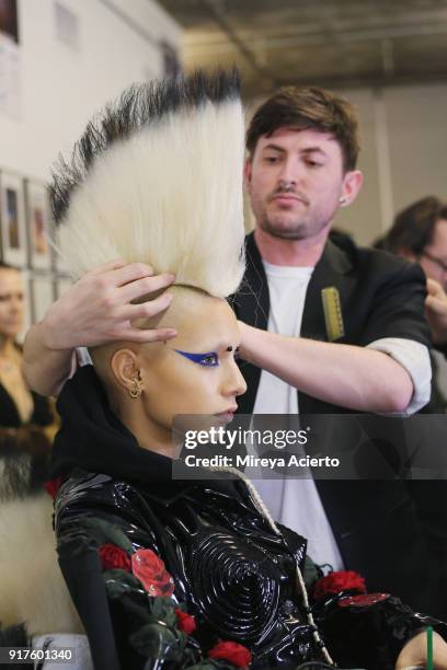 Model prepares backstage during the Kaimin fashion show at the Glass Houses on February 12, 2018 in New York City.