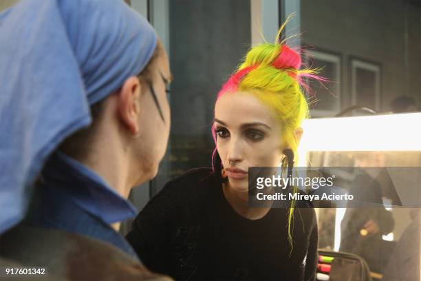 Model prepares backstage during the Kaimin fashion show at the Glass Houses on February 12, 2018 in New York City.
