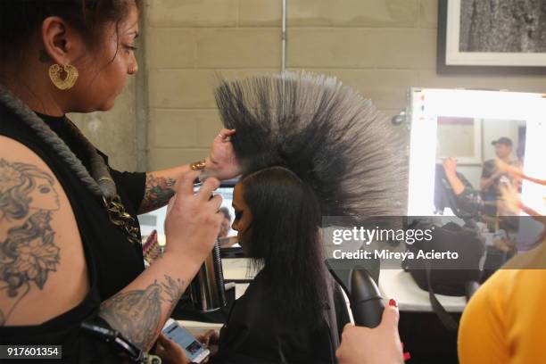 Model prepares backstage during the Kaimin fashion show at the Glass Houses on February 12, 2018 in New York City.