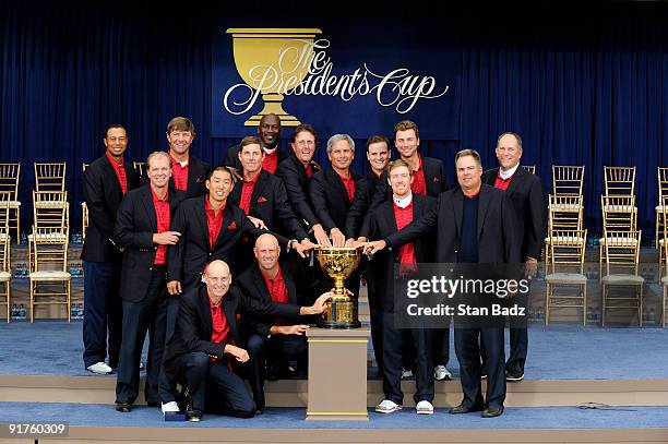 Members of the USA Team pose on stage at the closing ceremonies after the USA defeated the International Team 19.5 to 14.5 to win The Presidents Cup...