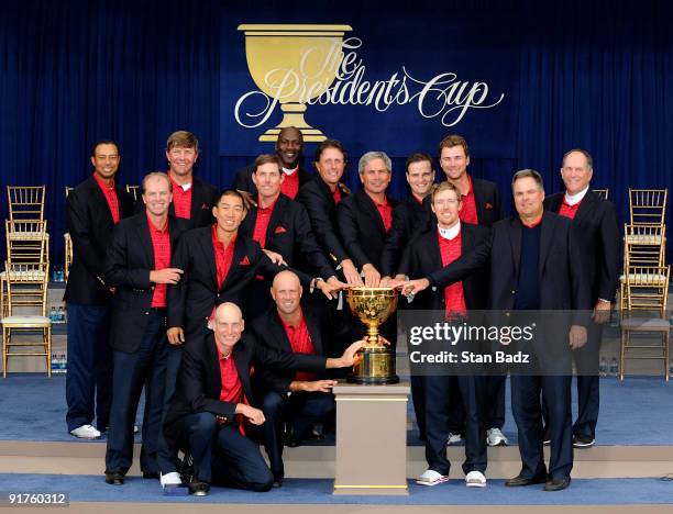 Members of the USA Team pose on stage at the closing ceremonies after the USA defeated the International Team 19.5 to 14.5 to win The Presidents Cup...