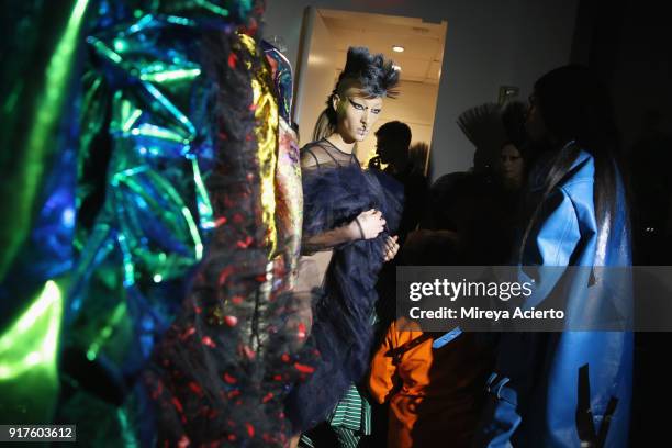 Model prepares backstage during the Kaimin fashion show at the Glass Houses on February 12, 2018 in New York City.