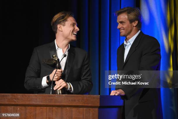 Actor Elijah Allan-Blitz and professional surfer Laird Hamilton accept the 2018 Lumiere award for Best Sports VR Experience onstage at the Advanced...