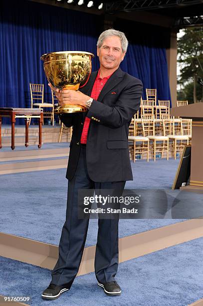 Team Captain Fred Couples pose on stage at the closing ceremonies after the USA defeated the International Team 19.5 to 14.5 to win The Presidents...